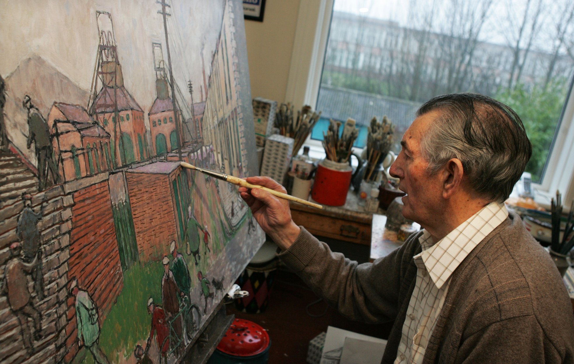 Norman Cornish sat painting in studio